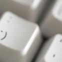 cheeky emoticon on a computer keyboard