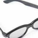 Retro glasses or spectacles with heavy black plastic frames on a white background, high angle view