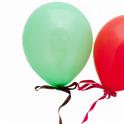 red and green party baloons on white background